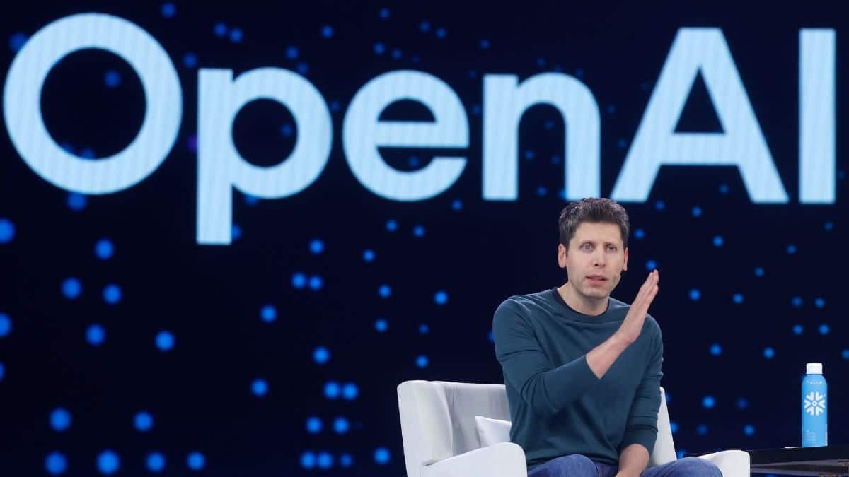 Sam Altman speaking at a tech event, likely discussing OpenAI's strategic shift due to a major AI breakthrough