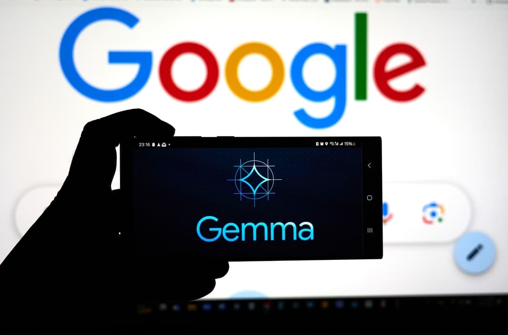 A Nintendo Switch handheld console displays text output from Google's Gemma AI model, with code lines visible on screen
