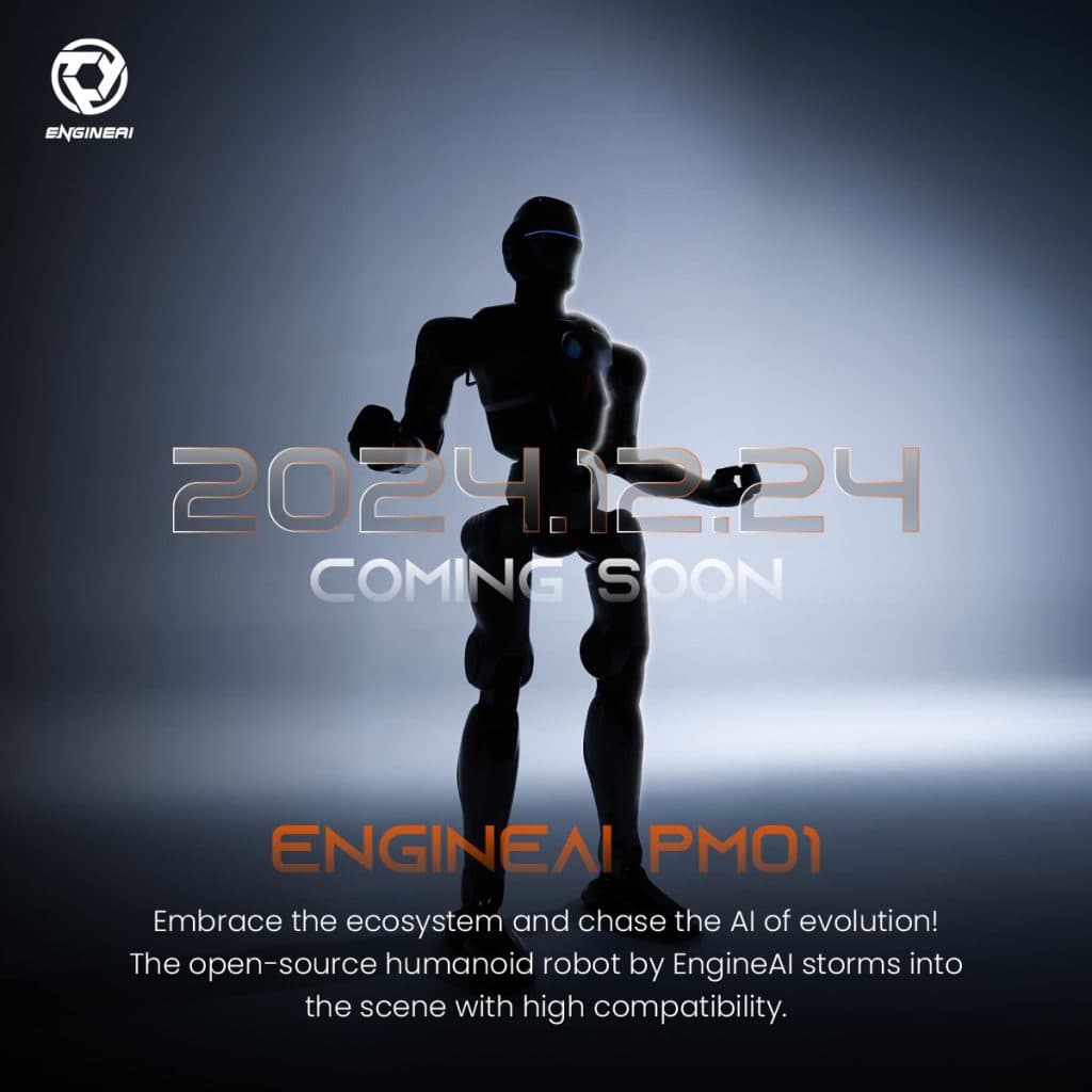 A humanoid robot kneeling on a concrete floor with legs bent, surrounded by two people in casual clothing; one…