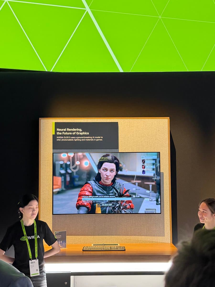 NVIDIA staff member at a podium addressing journalists, with a screen showing DLSS5 lighting comparison in a game scene
