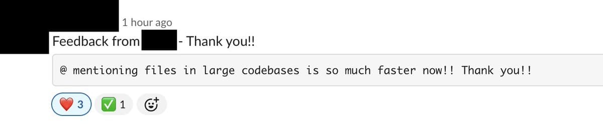 Engineer types code on a laptop displaying Anthropic's Claude Code interface, with highlighted @-mention syntax and…