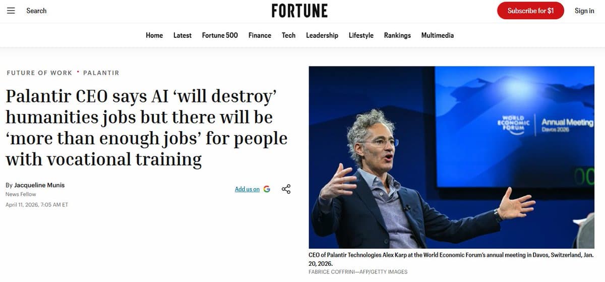Alex Karp, Palantir CEO in a suit, speaks at a tech conference, gesturing with one hand, audience visible in background