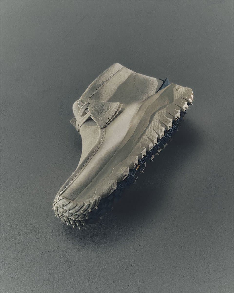 Moncler Trailgrip boots in bold colors beside Clarks Originals and Rick Owens collab footwear on a studio display