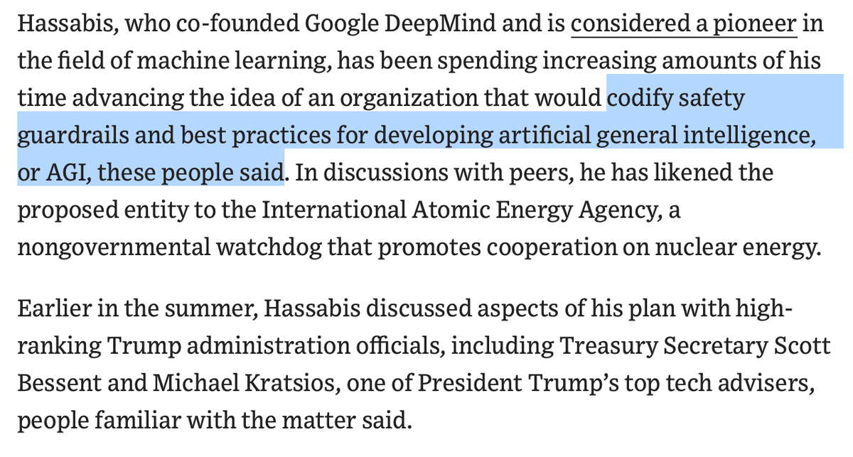 Demis Hassabis in a suit speaking to officials in a White House meeting room, gesturing toward charts on AI safety