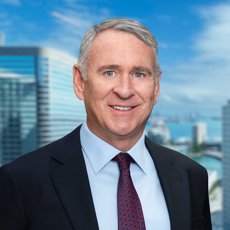 Ken Griffin, CEO of Citadel, in a business suit, speaks at a conference with a skeptical expression, addressing AI's…