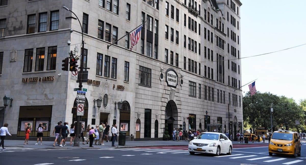 Pedestrians walk past Bergdorf Goodman under scaffolding on Fifth Avenue, part of a major streetscape renovation to…