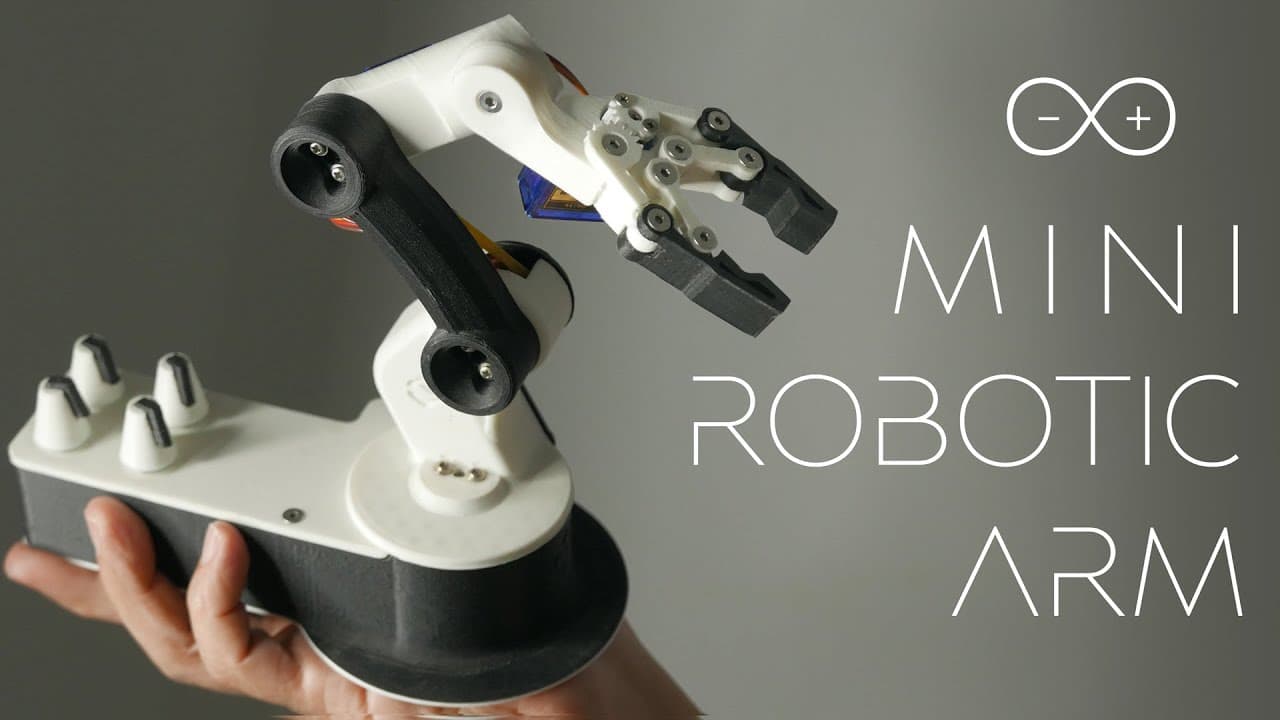 A robotic arm with a needle and thread, guided by an augmented reality interface, precisely threads a needle on a…