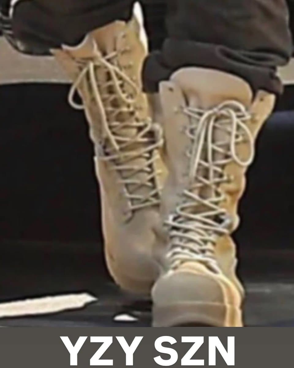 Kanye West showcases a lineup of chunky YZY sneakers in varied earth tones arranged on a studio floor, with no…