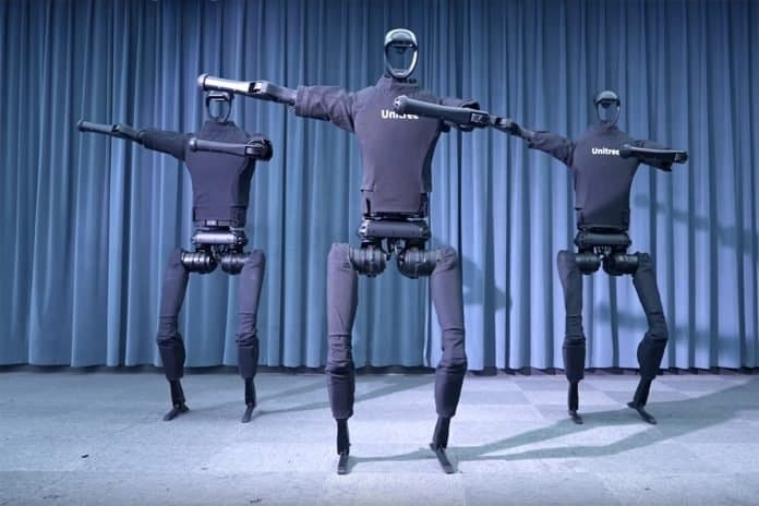 Unitree H1 humanoid robot running on a track, its articulated legs and torso in mid-stride, approaching the speed of…
